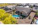 Private backyard features a kidney shaped pool, desert landscaping, and desert foliage, providing a desert oasis at 1019 N Tambor Cir, Mesa, AZ 85207
