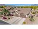 Aerial view of a well-maintained property featuring desert landscaping and a two-car garage at 1019 N Tambor Cir, Mesa, AZ 85207