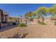 Wide backyard with a pool, firepit, desert landscaping, seating, rock features and scenic views at 1019 N Tambor Cir, Mesa, AZ 85207