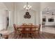 Charming dining room featuring a wooden table set and stylish lighting fixture, ideal for Gathering gatherings at 1019 N Tambor Cir, Mesa, AZ 85207