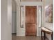 Warm and inviting entryway featuring a wood door with sidelights and transom window at 1019 N Tambor Cir, Mesa, AZ 85207