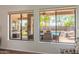 Bright living room with view to outdoor dining, pool and backyard putting green at 1019 N Tambor Cir, Mesa, AZ 85207