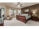 Comfortable main bedroom boasts a large window with natural light and a relaxing chair at 1019 N Tambor Cir, Mesa, AZ 85207