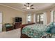 Bright main bedroom with ceiling fan overlooks the backyard, offering a private retreat at 1019 N Tambor Cir, Mesa, AZ 85207
