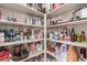 Well-stocked pantry with organized shelving offers ample storage for food and kitchen essentials at 1019 N Tambor Cir, Mesa, AZ 85207