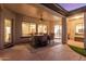 Covered patio featuring an outdoor dining area and a ceiling fan for comfortable entertaining at 1019 N Tambor Cir, Mesa, AZ 85207