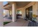 Spacious covered patio showcases an outdoor dining area and seamless transition to indoor living at 1019 N Tambor Cir, Mesa, AZ 85207