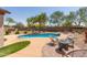 Beautiful pool and yard with desert landscaping and custom pavers at 1019 N Tambor Cir, Mesa, AZ 85207