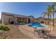 Inviting backyard pool area with desert landscaping, and a patio seating area perfect for outdoor dining at 1019 N Tambor Cir, Mesa, AZ 85207