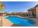 Private backyard pool and patio for entertaining, surrounded by desert landscaping at 1019 N Tambor Cir, Mesa, AZ 85207