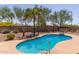 Inviting pool with desert landscaping, boulders, and easy access at 1019 N Tambor Cir, Mesa, AZ 85207