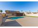 Spacious backyard with a pool, solar panels, and ample room for recreation at 1207 E Sequoia Dr, Phoenix, AZ 85024