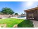 Lush backyard with a pool, grill area, and ample space for entertaining at 1207 E Sequoia Dr, Phoenix, AZ 85024