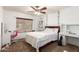 Bedroom with an accent window, desk, and a full sized bed at 1207 E Sequoia Dr, Phoenix, AZ 85024