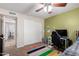 Bedroom with sliding door closet, ceiling fan, colorful rug, and a full sized bed at 1207 E Sequoia Dr, Phoenix, AZ 85024