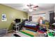 Bedroom with ceiling fan, desk, colorful rug, and a full sized bed at 1207 E Sequoia Dr, Phoenix, AZ 85024