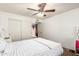 Bedroom with sliding door closet, ceiling fan, and a full sized bed at 1207 E Sequoia Dr, Phoenix, AZ 85024