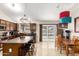 Modern kitchen featuring stainless steel appliances, dark cabinets, and center island seating at 1207 E Sequoia Dr, Phoenix, AZ 85024