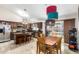 Eat-in kitchen with dark wood cabinets, stainless appliances, center island, and a view of the pool at 1207 E Sequoia Dr, Phoenix, AZ 85024