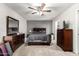 Comfortable bedroom featuring neutral tones, a ceiling fan, carpet flooring, and dresser storage at 1207 E Sequoia Dr, Phoenix, AZ 85024