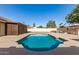 Sparkling swimming pool surrounded by a spacious patio area and beautifully landscaped backyard, perfect for entertaining at 1207 E Sequoia Dr, Phoenix, AZ 85024