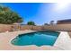 Clear blue swimming pool with a patio and barbecue area for outdoor enjoyment at 1207 E Sequoia Dr, Phoenix, AZ 85024
