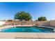 Inviting swimming pool with a built-in barbecue and relaxation area in the backyard at 1207 E Sequoia Dr, Phoenix, AZ 85024