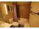 Functional bathroom with a tub-shower combination and storage provides essential amenities at 18436 W Shasta St, Goodyear, AZ 85338