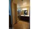 Bathroom featuring glass shower, double sinks, vanity and tile flooring at 18436 W Shasta St, Goodyear, AZ 85338
