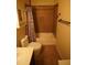 Functional bathroom with a tub-shower combination and storage provides essential amenities at 18436 W Shasta St, Goodyear, AZ 85338