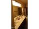 Bathroom featuring double sinks and vanity with tile flooring and natural light at 18436 W Shasta St, Goodyear, AZ 85338