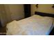Comfortable bedroom featuring a bed with a patterned coverlet, offering a restful retreat at 18436 W Shasta St, Goodyear, AZ 85338