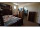 This bedroom features an arched entrance to bathroom, adding architectural detail and convenience at 18436 W Shasta St, Goodyear, AZ 85338