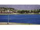 Panoramic lake view featuring waterfront homes and a mountain backdrop in the Estrella community at 18436 W Shasta St, Goodyear, AZ 85338