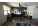 Bright living room with a feature wall, entertainment center, and modern flooring at 18436 W Shasta St, Goodyear, AZ 85338
