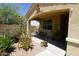 Cozy covered porch featuring desert landscaping at 18436 W Shasta St, Goodyear, AZ 85338