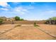 Spacious backyard featuring a basketball hoop, pavers, gazebo, and lush greenery at 21033 N Alexis Ave, Maricopa, AZ 85138