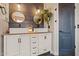 Bathroom featuring dual sinks, a modern design, and plenty of counter space at 21033 N Alexis Ave, Maricopa, AZ 85138