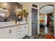 This bathroom is equipped with double sinks, modern fixtures and an adjacent bedroom at 21033 N Alexis Ave, Maricopa, AZ 85138