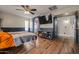 This bedroom features a mounted TV and an en suite bathroom at 21033 N Alexis Ave, Maricopa, AZ 85138