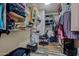 A walk-in closet provides organization with ample shelving and a vanity at 21033 N Alexis Ave, Maricopa, AZ 85138