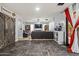 Spacious living room with hardwood flooring, comfortable seating, and backyard access at 21033 N Alexis Ave, Maricopa, AZ 85138