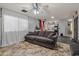 Comfortable living room features tile floors, backyard access, and open access to the kitchen at 21033 N Alexis Ave, Maricopa, AZ 85138