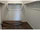 Walk-in closet with shelving, and a carpet remnant at 25146 W Wayland Dr, Buckeye, AZ 85326
