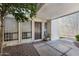 Inviting entrance with a tidy, landscaped courtyard leading to the front door at 3002 N 70Th St # 120, Scottsdale, AZ 85251