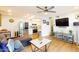 Bright living room with stainless steel appliances, sleek furniture, and an open floor plan at 3002 N 70Th St # 120, Scottsdale, AZ 85251