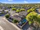 Aerial view of a private backyard with a pool, solar panels, mature landscaping, and an outdoor gazebo at 32881 N Hidden Canyon Dr, San Tan Valley, AZ 85144