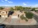 Aerial view of a well-maintained home with mature trees and a large driveway at 32881 N Hidden Canyon Dr, San Tan Valley, AZ 85144