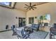 Covered patio with ceiling fan, outdoor seating, and sliding glass door access at 32881 N Hidden Canyon Dr, San Tan Valley, AZ 85144