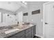 Bathroom featuring double sinks, granite countertops, and updated fixtures at 32881 N Hidden Canyon Dr, San Tan Valley, AZ 85144